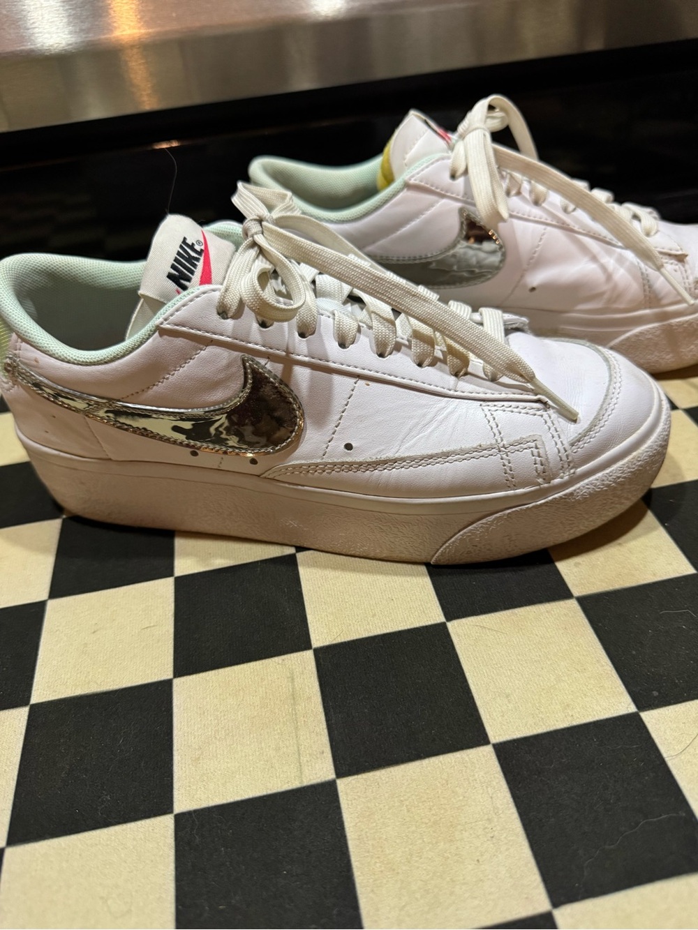 Nike Women’s White Low-Top Sneakers with Metallic Silver Swoosh